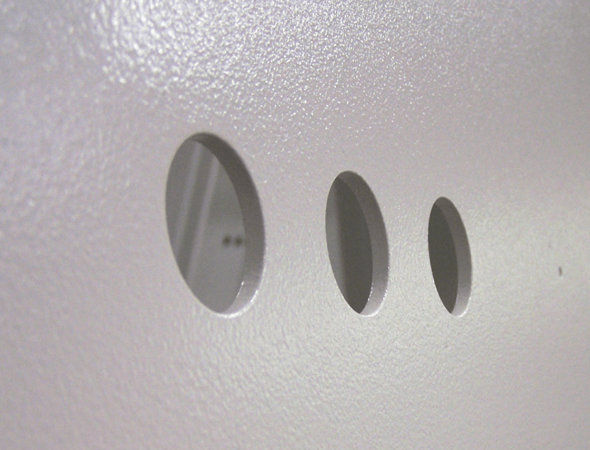 Powder-coated enclosure with knockouts