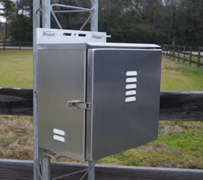 Tower-mounted powder-coated enclosure